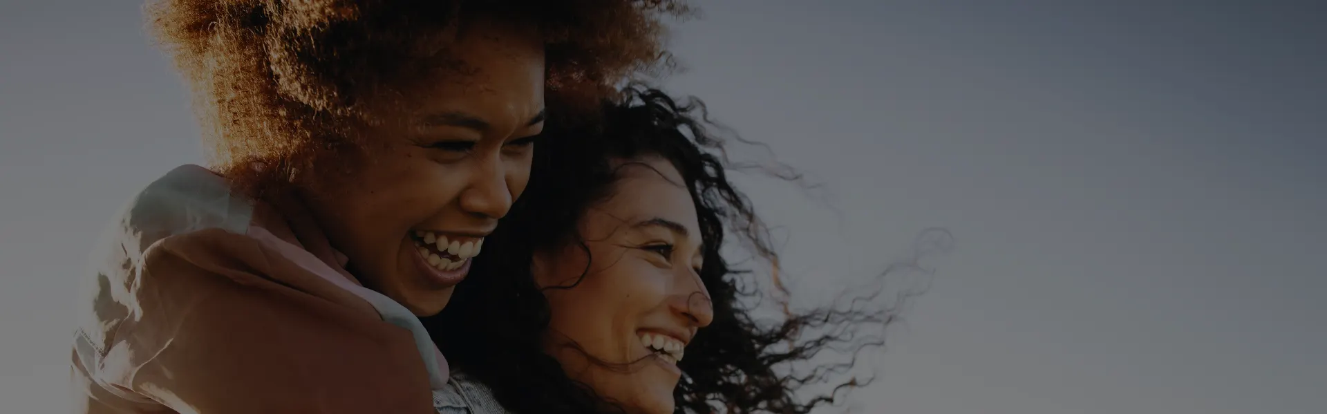 Two women laughing together