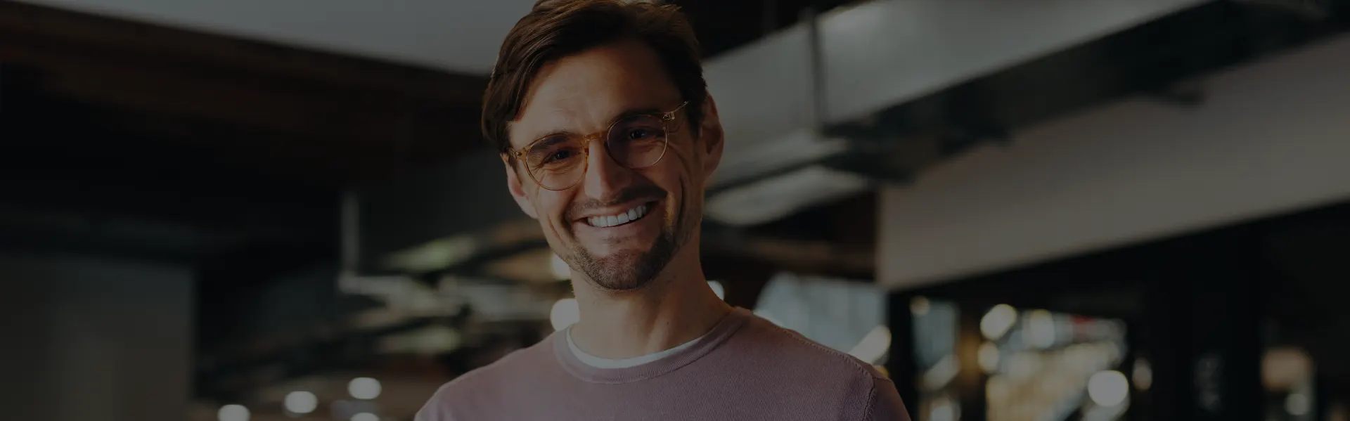 Man in glasses smiling