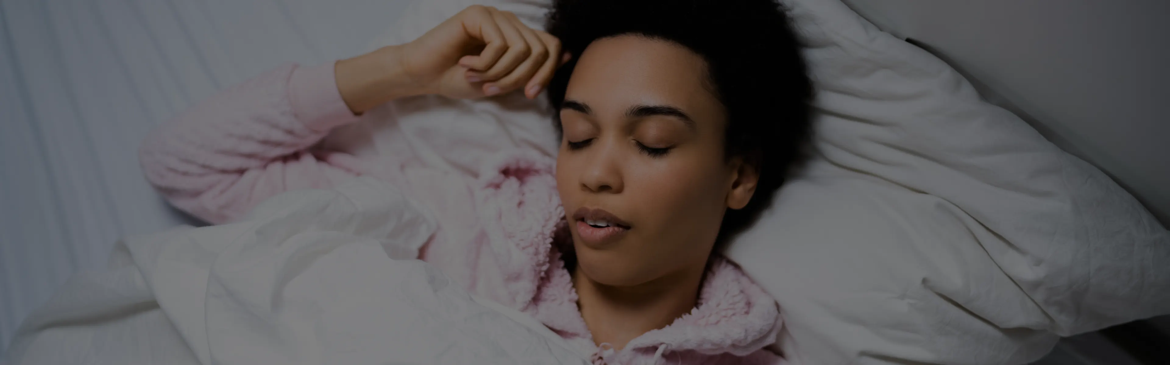 Woman asleep in bed