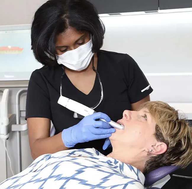 Dentist taking an intraoral scan of a patient at York House