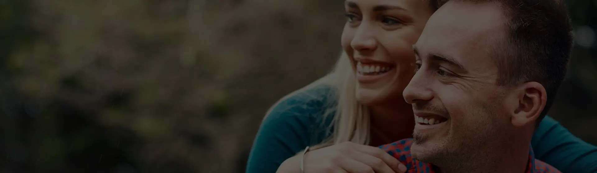 Couple laughing together outdoors